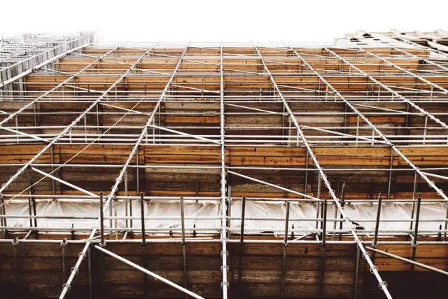 Scaffolding against a New Orleans building during a full roof replacement