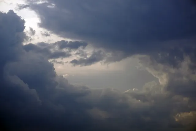 Storm clouds over New Orleans rooftops during hurricane season